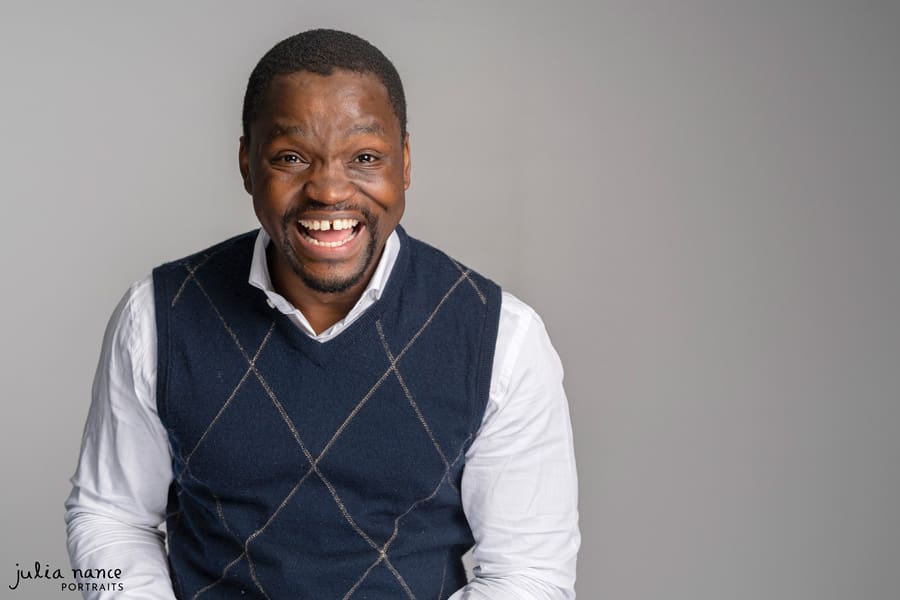 Melbourne Personal Branding Photography Portrait of a man wearing a vest and shirt, with a big smile on his face