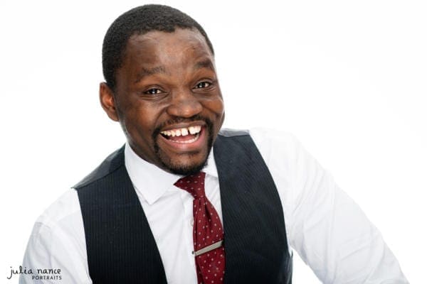 Melbourne Corporate Headshot of a man wearing business attire with a big smile on his face, on a white background