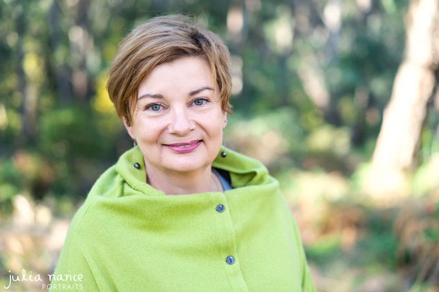 Melbourne corporate headshot of woman standing outdoors with natural outdoor setting