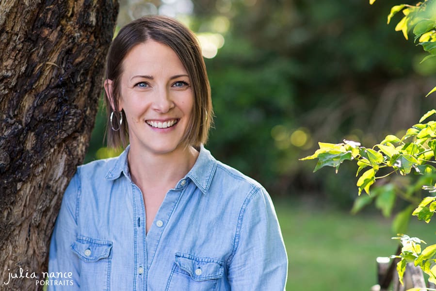 Woman standing outside amongst tree and greenery - Melbourne personal branding and headshot photography - linkedin headshots and corporate headshots