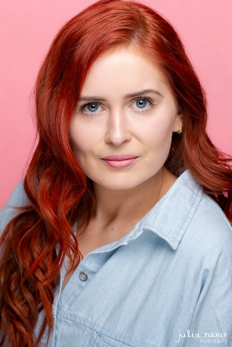 Melbourne actor headshot on woman with red hair on pink background