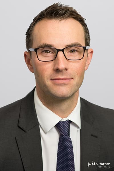 Melbourne staff headshot of employee on light grey background