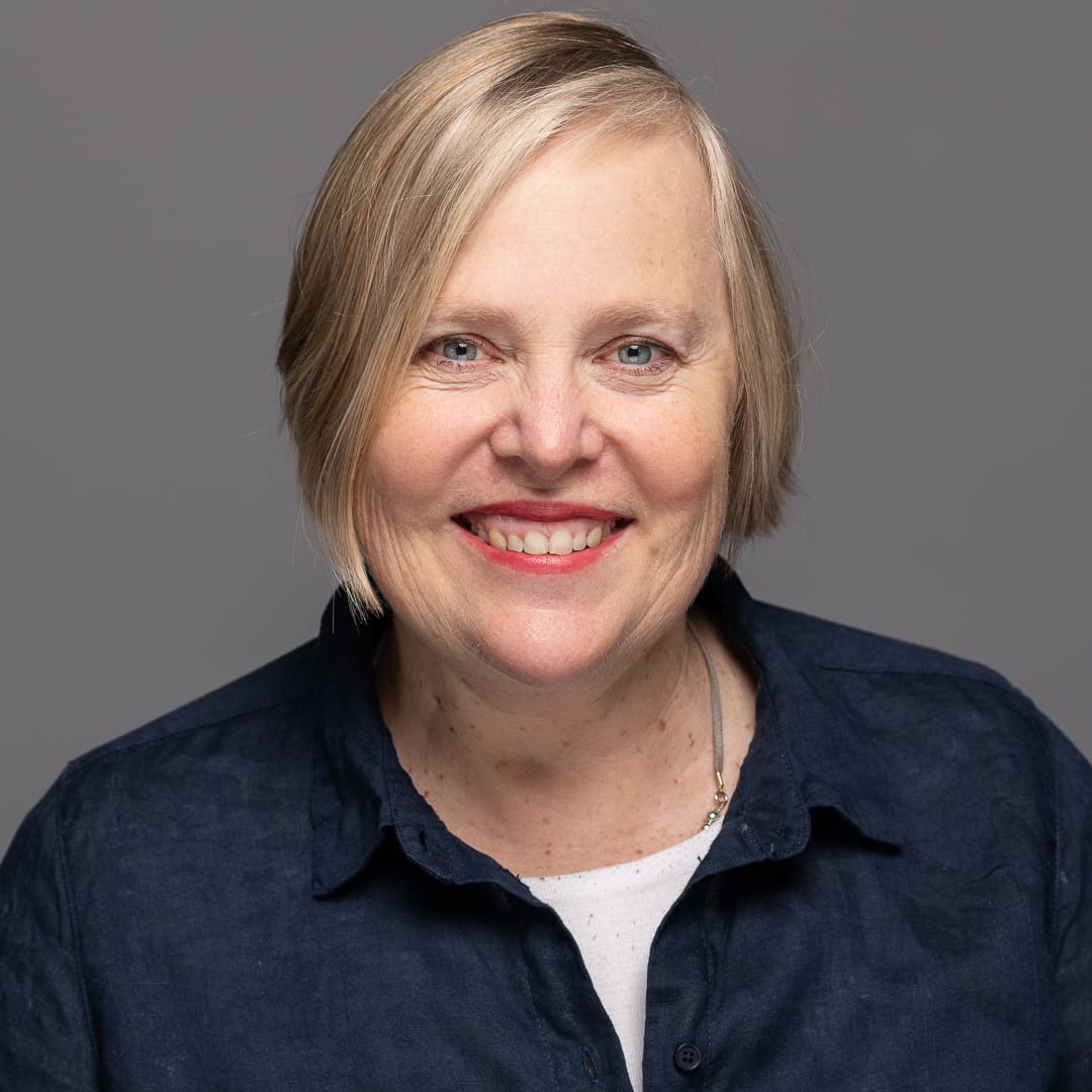 Smiling headshot of woman taken in melbourne photography studio