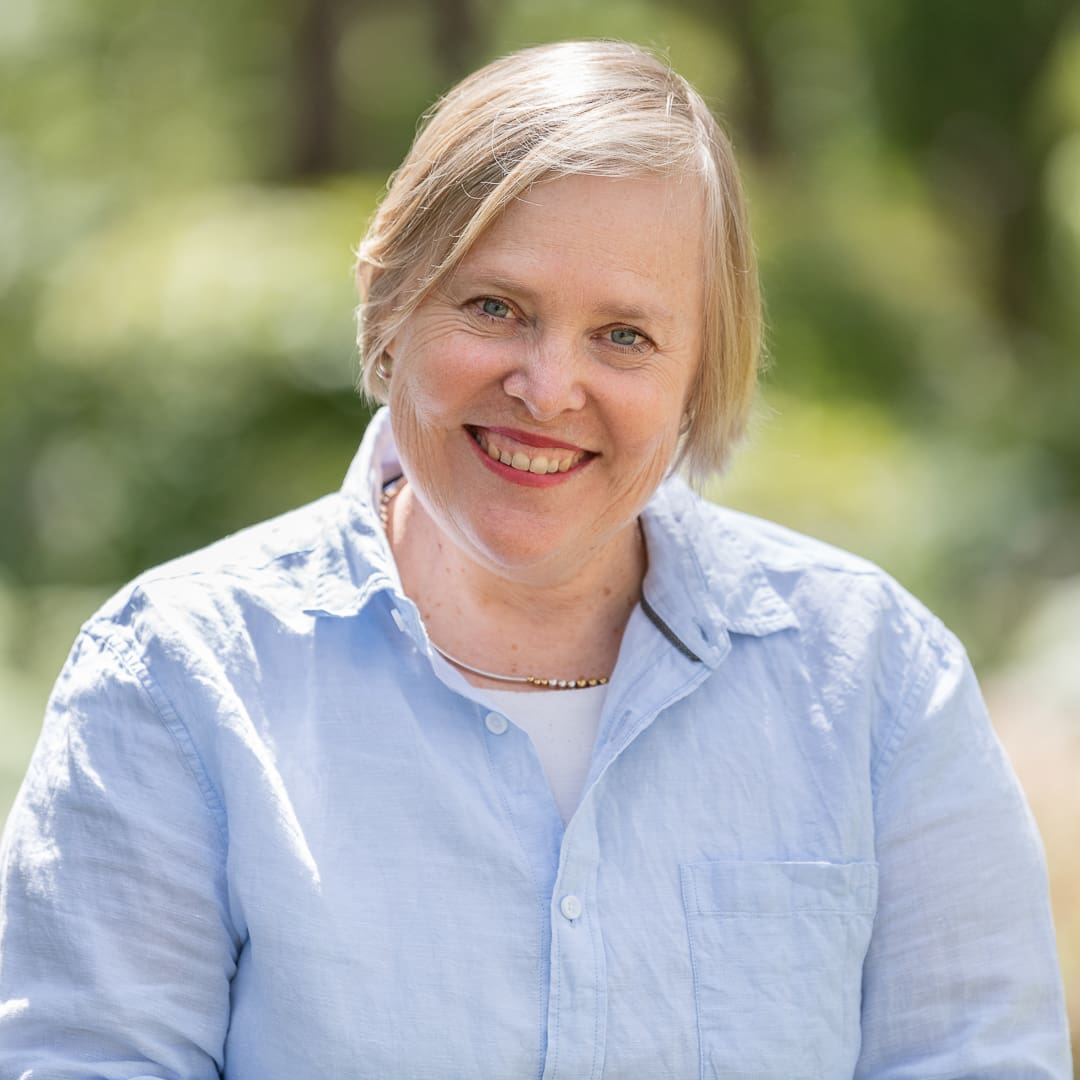 Melbourne business woman smiles to camera for relaxed corporate headshot