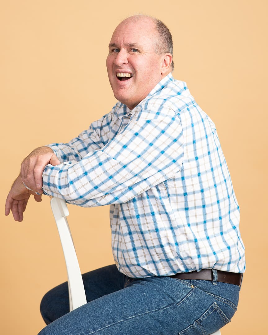Melbourne man laughs in relaxed studio personal branding portrait