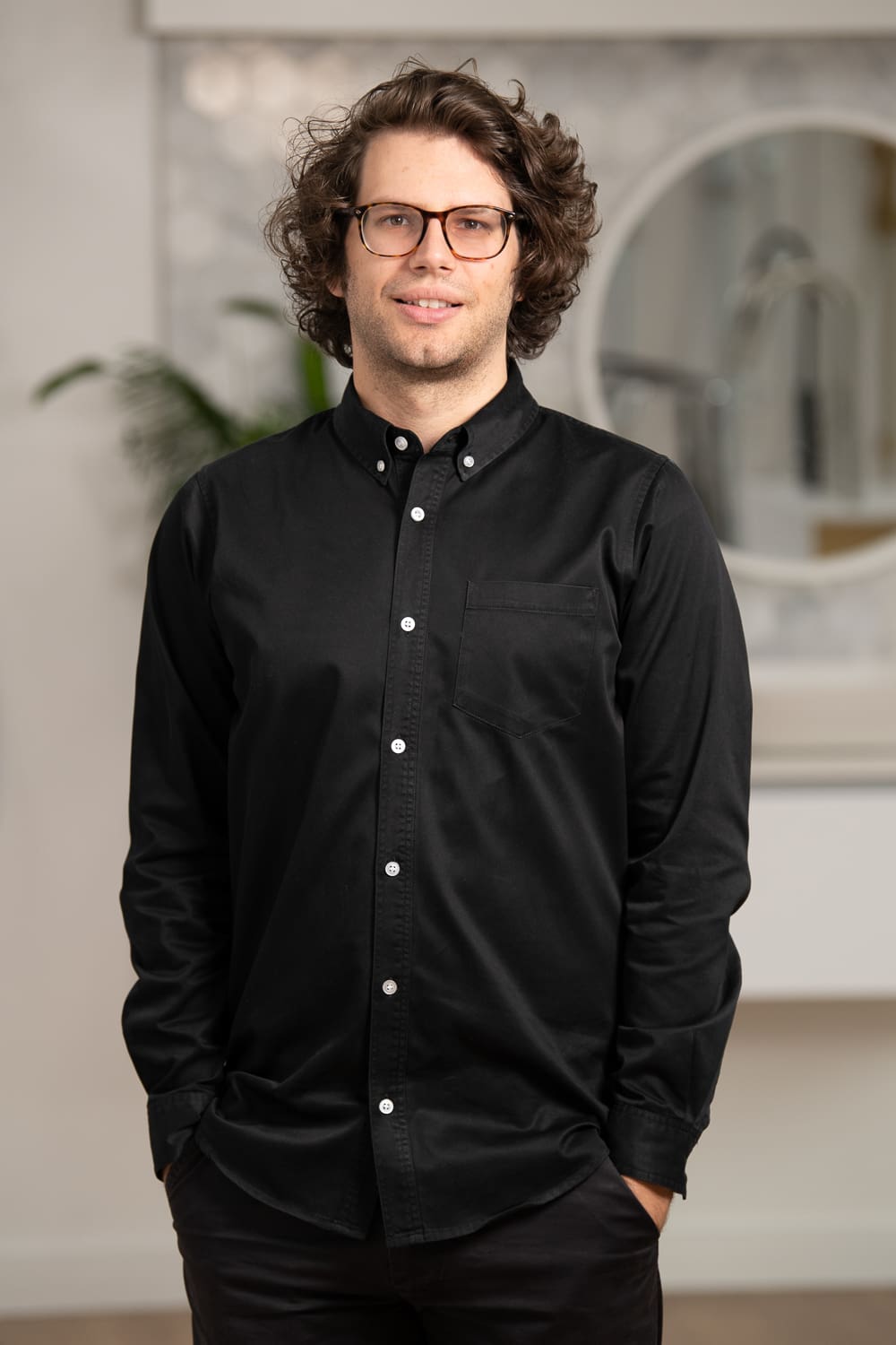 Melbourne team headshot photography. Branding portrait with a blurred background captured in workplace.