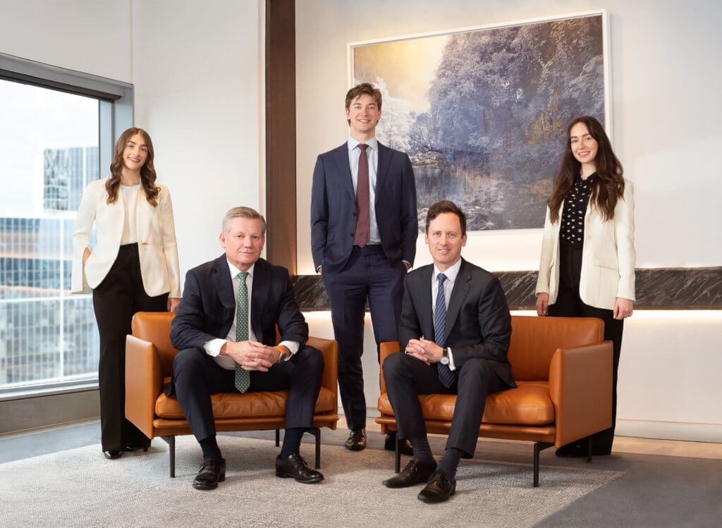 Corporate team photograph of 5 people.